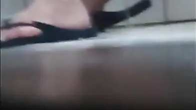 Irresistible blonde mature jerks off hard in a bathroom booth