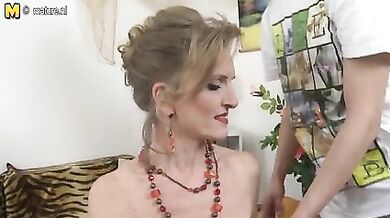 Voluptuous busty mature blows a young dude for a medal