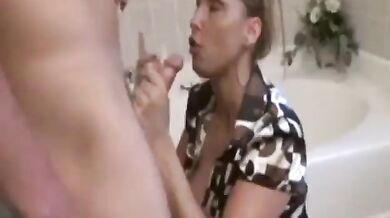 Attractive milf Stacie Starr blows young ramrod in the bathroom