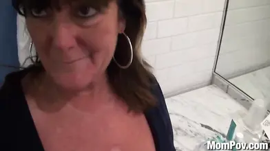 Raunchy mature granny with big jugs tugs a cock POV