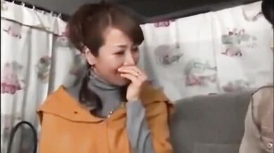 Mature Japanese redhead masturbates while having her big tits groped