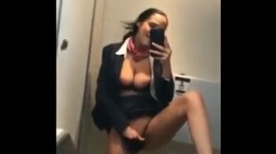 Kinky mature stewardess in stockings masturbates in the airplane toilet