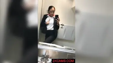 Kinky mature stewardess in stockings masturbates in the airplane toilet