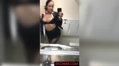 Kinky mature stewardess in stockings masturbates in the airplane toilet