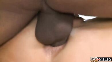 Busty mature stewardess fucked and facialized by a black stud