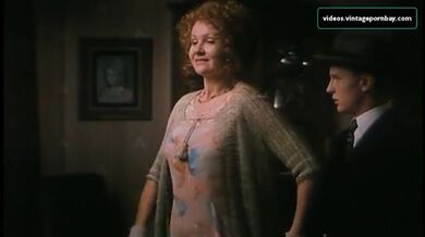 Vintage scene of the gorgeous mom seducing a young dude