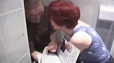 Redhead mature takes the pizza delivery guy to her bathroom