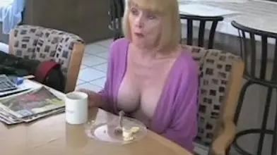 Bimbo mom seduces a young stud with her fake tits