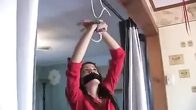 Slim Milf in high heeled leather boots enjoys self bondage