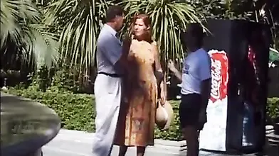 Mature redhead in floral dress is gangbanged outdoors and indoors