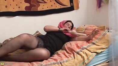 Naughty mature granny with big jugs plays with a dildo