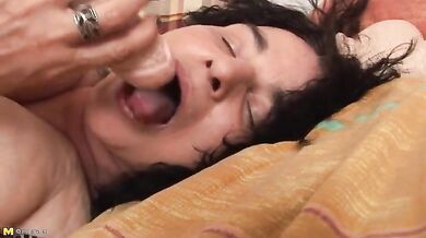 Naughty mature granny with big jugs plays with a dildo