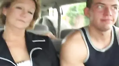 Hot cougar MILF bangs with a young guy in car