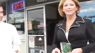 Hot cougar MILF bangs with a young guy in car