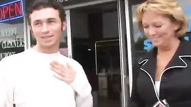 Hot cougar MILF bangs with a young guy in car