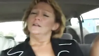 Hot cougar MILF bangs with a young guy in car