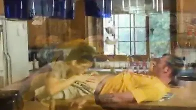 Lusty MILF eats a hard young cock in the kitchen