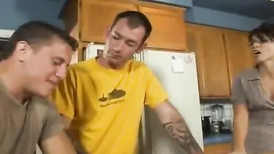 Lusty MILF eats a hard young cock in the kitchen