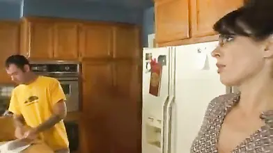 Lusty MILF eats a hard young cock in the kitchen
