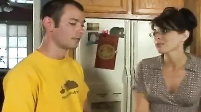 Lusty MILF eats a hard young cock in the kitchen