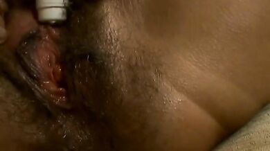 Hairy mature bitch plays with her favorite dildo on sofa