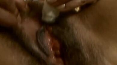 Hairy mature bitch plays with her favorite dildo on sofa