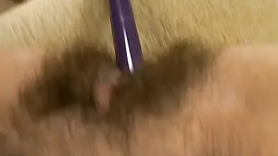 Hairy mature bitch plays with her favorite dildo on sofa