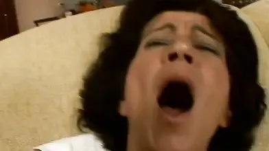 Hairy mature bitch plays with her favorite dildo on sofa