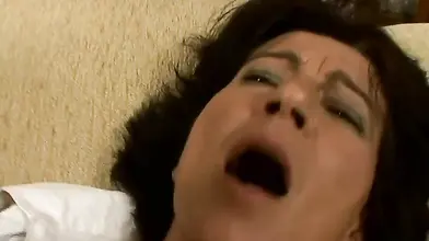 Hairy mature bitch plays with her favorite dildo on sofa