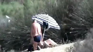Pervert Granny Masturbates at Beach