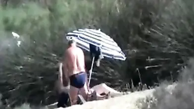 Pervert Granny Masturbates at Beach