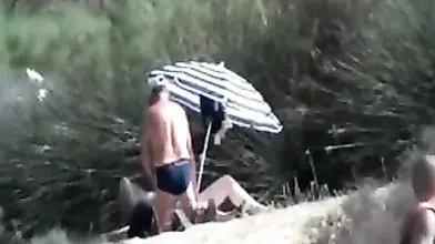 Pervert Granny Masturbates at Beach