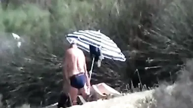 Pervert Granny Masturbates at Beach
