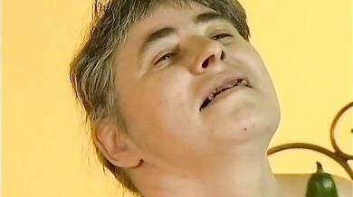 Mature Skank Plays with Cucumber