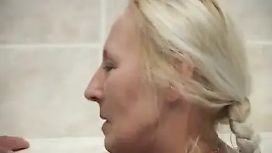 Mature Blonde MILF Washes Young Man's Cock