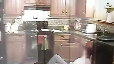 Blonde Cougar Seduces Stud in Kitchen
