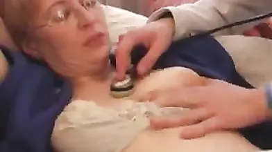 Mature Cougar Seduces Young Stud on Sofa