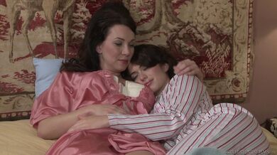 Lesbian Brunette Strips Cougar's Corset