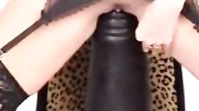 Mature Woman Rides Giant Black Dildo