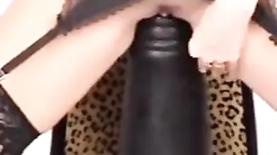 Mature Woman Rides Giant Black Dildo