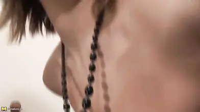 Mature Brunette Plays with Her Body