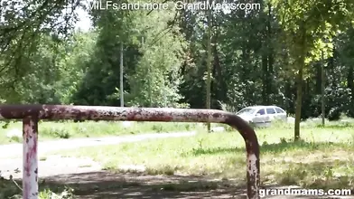 Mature Redhead Sucks in the Woods