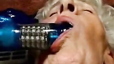 Mature Granny Plays Hard on the Couch