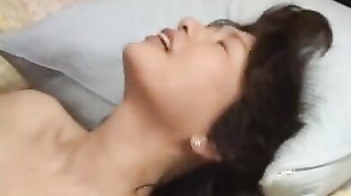 Brunette Japanese MILF Sticks It Deep